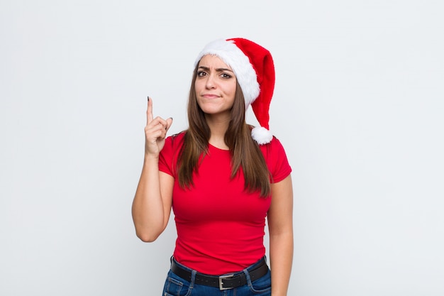 Young pretty woman with santa hat. Christmas concept. 