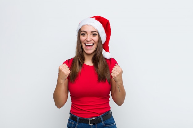 Young pretty woman with santa hat. Christmas concept. 