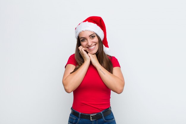 Young pretty woman with santa hat. Christmas concept. 