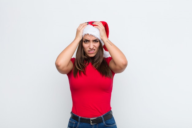 Young pretty woman with santa hat. Christmas concept. 