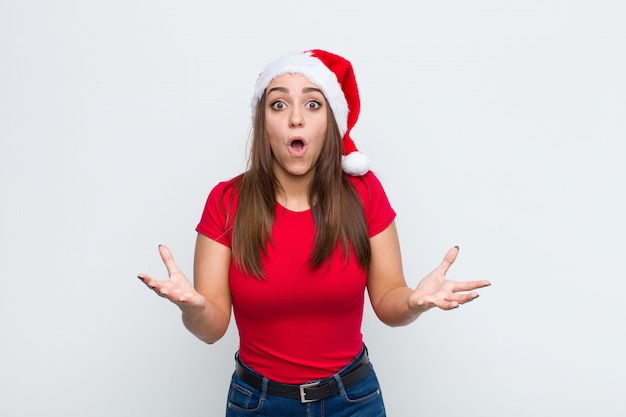 Young pretty woman with santa hat. Christmas concept. 