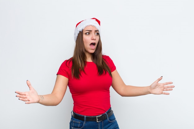 Young pretty woman with santa hat. Christmas concept. 