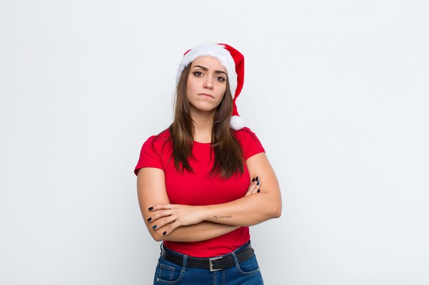 Young pretty woman with santa hat. Christmas concept. 