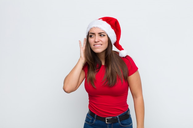 Young pretty woman with santa hat. Christmas concept. 