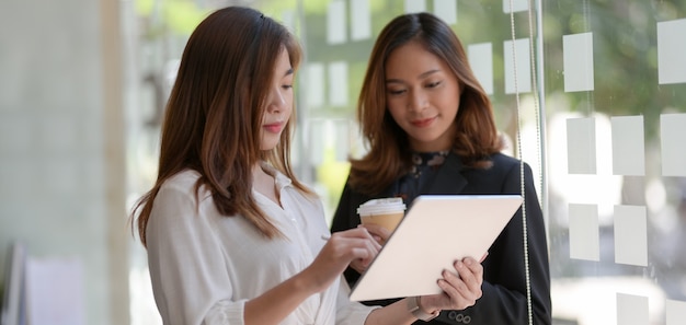 Young professional businesswoman discussing the project together