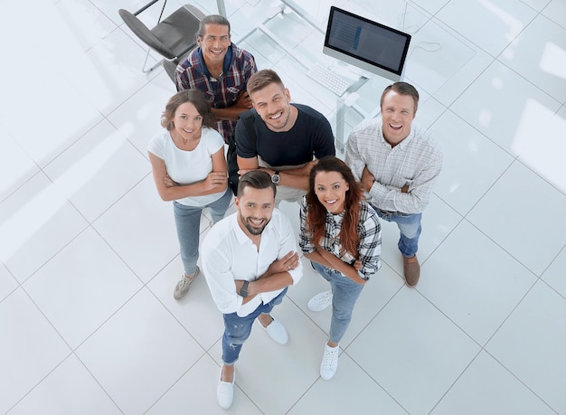 Young professionals standing near the desktop