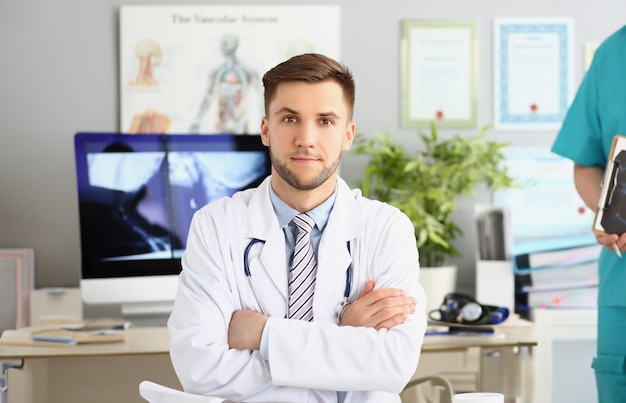 Young qualified medical worker in hospital first day at work young male specialist in medicine