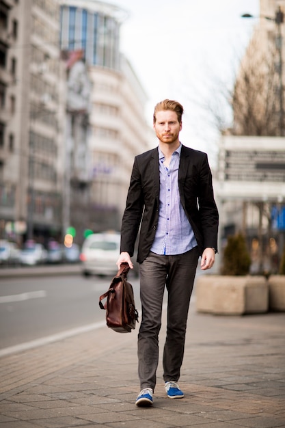 Young red hair man outdoors