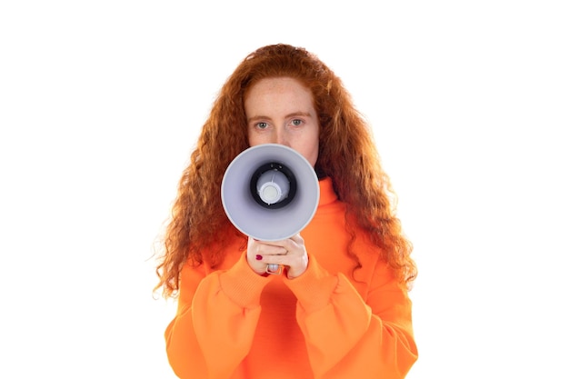 Young redhead woman girl screaming in megaphone