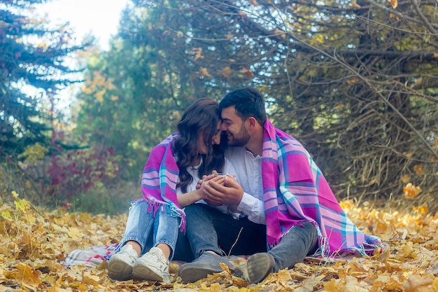 the young romantic couple in autumn park couple in the garden