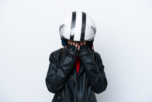 Young Russian girl with a motorcycle helmet isolated on white background with tired and sick expression