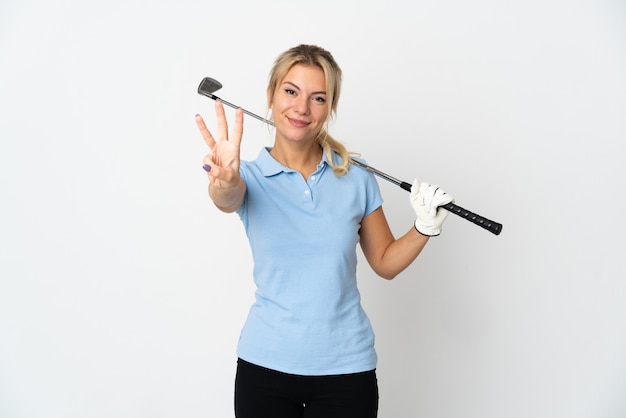 Young Russian golfer woman isolated on white background happy and counting three with fingers