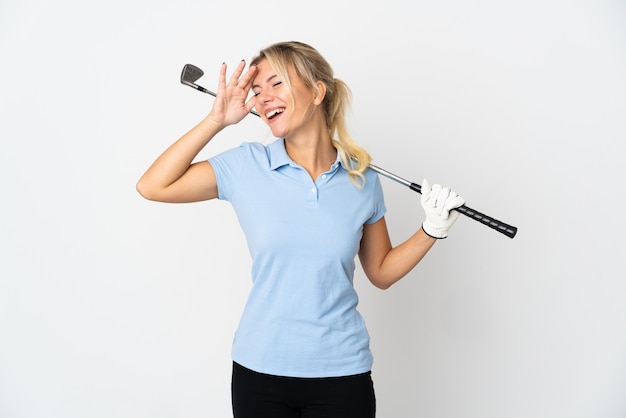 Young Russian golfer woman isolated on white background smiling a lot