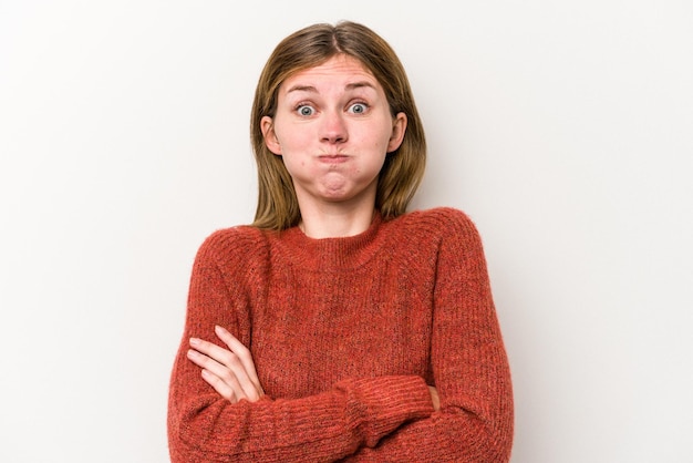 Young russian woman isolated on white background blows cheeks has tired expression Facial expression concept