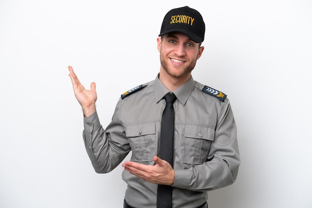 Young safeguard caucasian man isolated on white background extending hands to the side for inviting to come