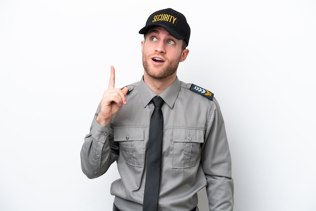 Young safeguard caucasian man isolated on white background thinking an idea pointing the finger up