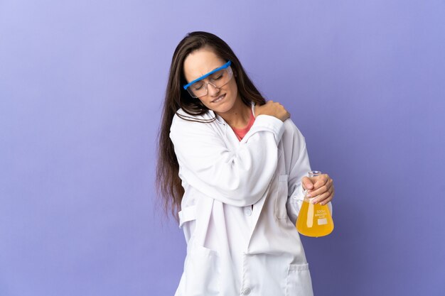 Young scientific woman over isolated background suffering from pain in shoulder for having made an effort