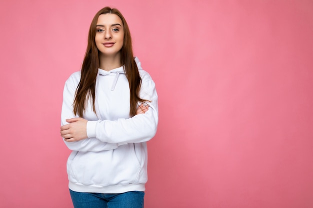 Young sexy beautiful brunet woman with sincere emotions isolated on background wall with copy space