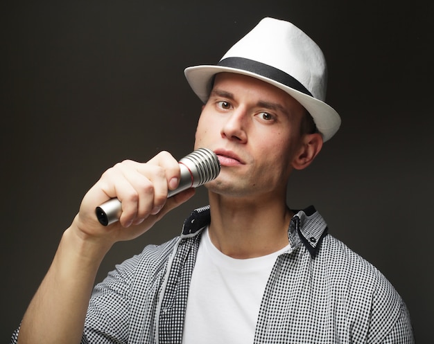 Young singer man with microphone