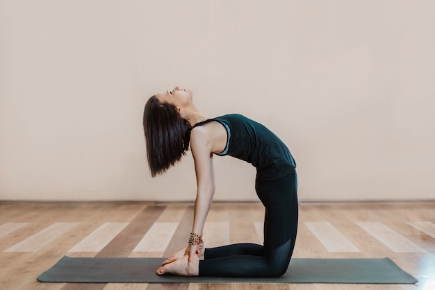 young slender woman doing yoga