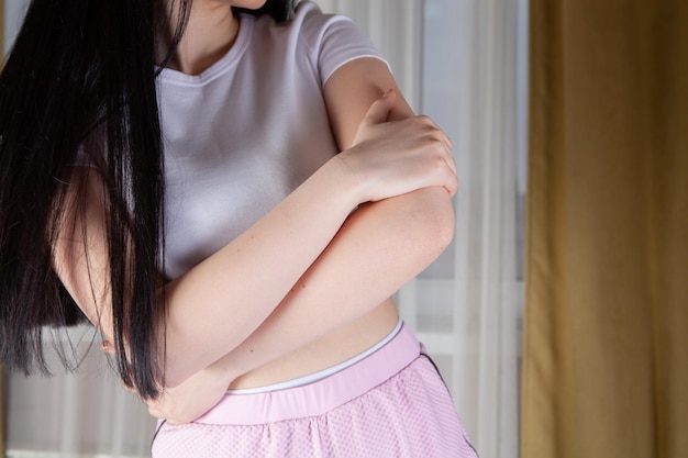 Young and slim girl doing exercises