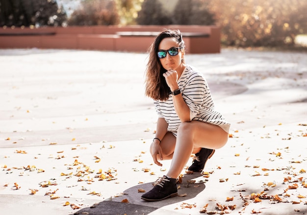 Young smiling attractive slim woman doing sports in morning sunrise dancing in sports wear healthy lifestyle having fun