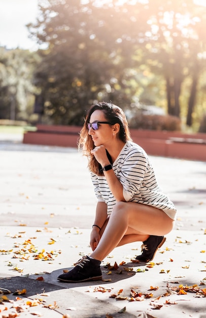 Young smiling attractive slim woman doing sports in morning sunrise dancing in sports wear healthy lifestyle having fun