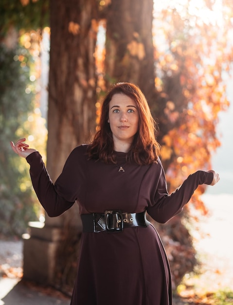 Young smiling attractive woman in morning sunrise dancing in dress healthy lifestyle having fun