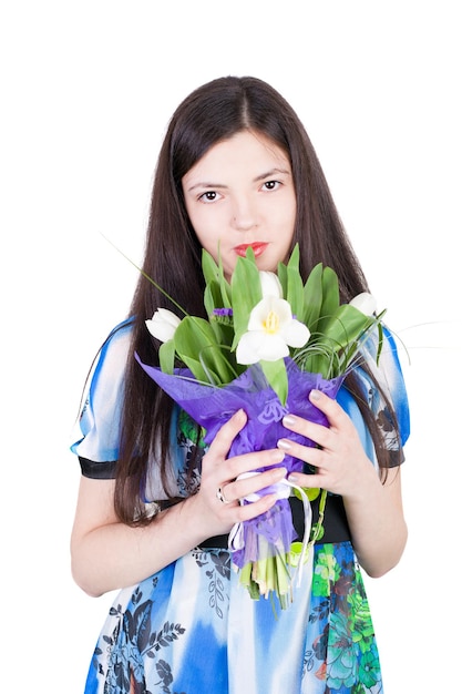 Young smiling beautiful girl with the flowers