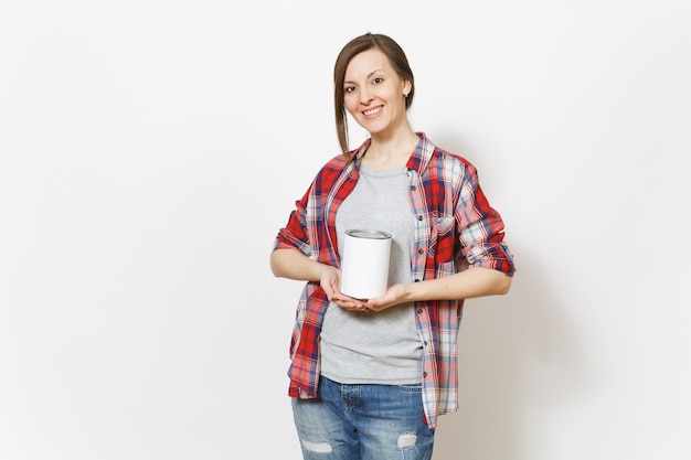 Young smiling beautiful woman in casual clothes holding empty paint tin can with copy space isolated on white background. Instruments, accessories for renovation apartment room. Repair home concept.