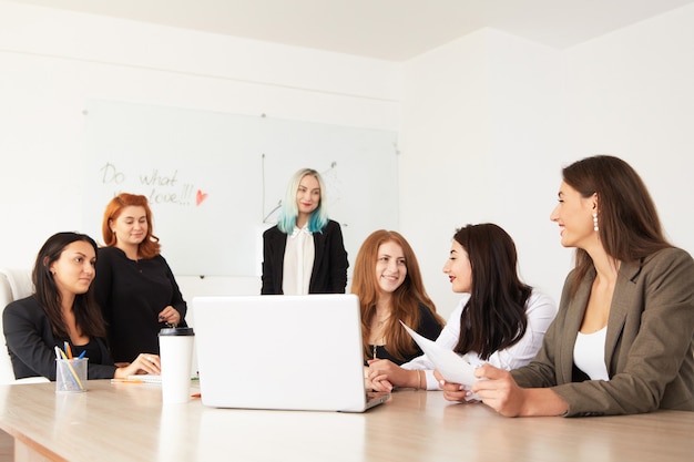 Young smiling business women working new project at office.