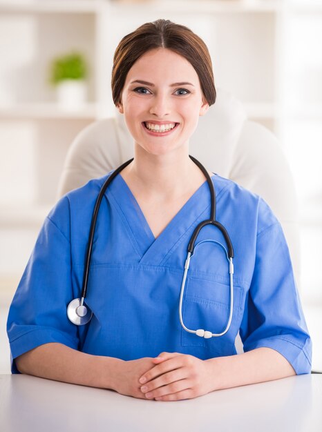 Young smiling female doctor with stethoscope.