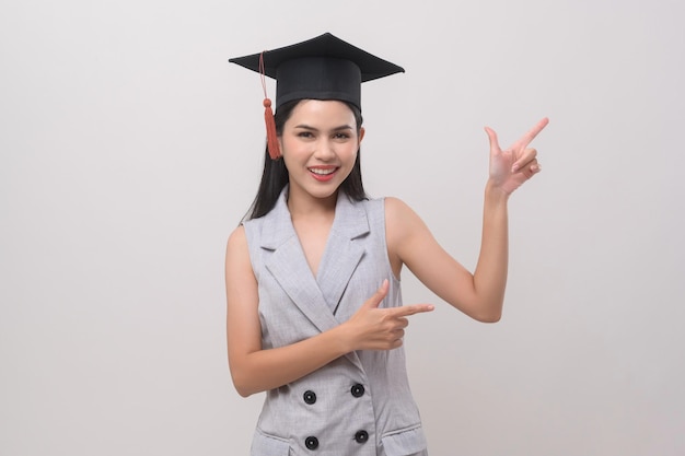 Young smiling woman wearing graduation hat education and university conceptx9