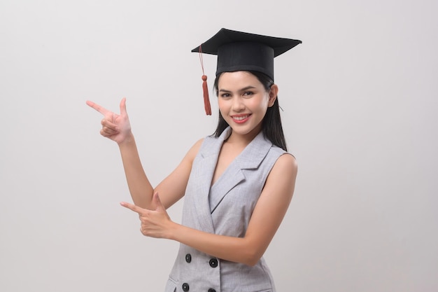 Young smiling woman wearing graduation hat education and university