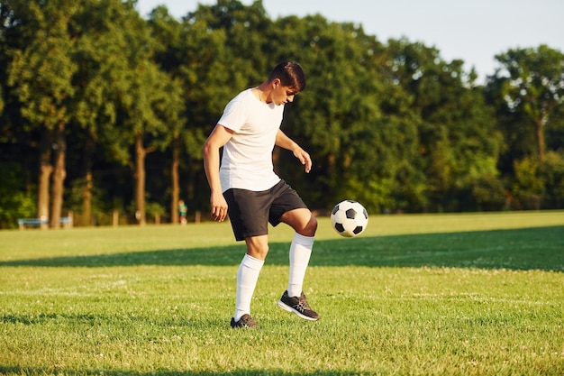 Young soccer player have training on the sportive field