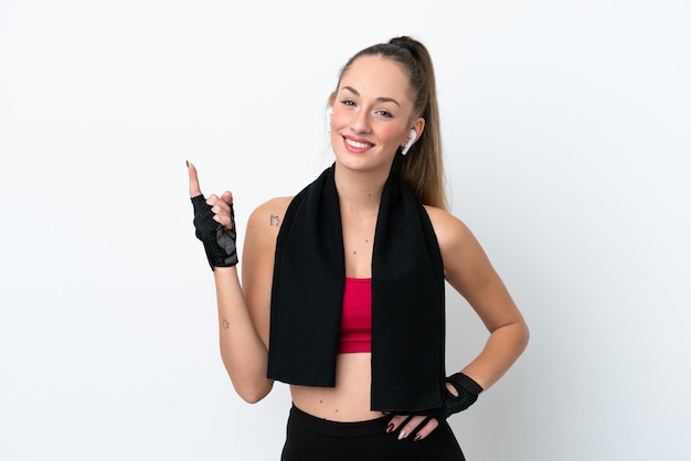 Young sport caucasian woman isolated on white background showing and lifting a finger in sign of the best