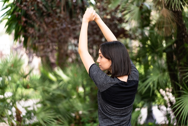 Young sport caucasian woman at outdoors in a park