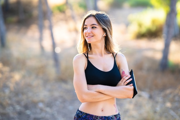 Young sport girl at outdoors looking to the side