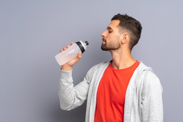 Young sport man with a bottle of water