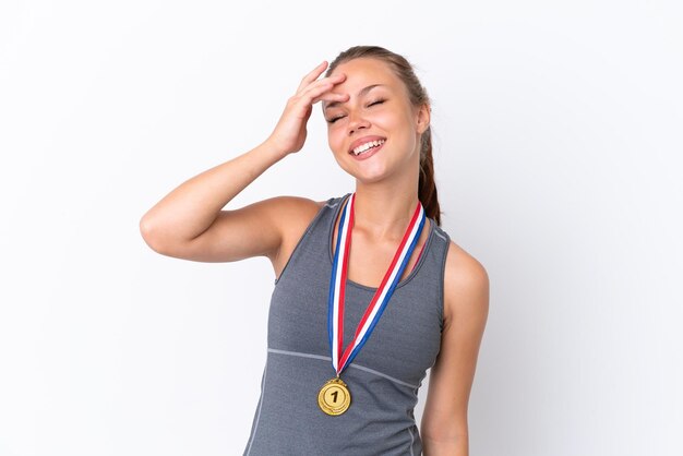 Young sport Russian girl with medals isolated on white background has realized something and intending the solution