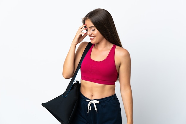 Young sport Uruguayan woman with sport bag isolated