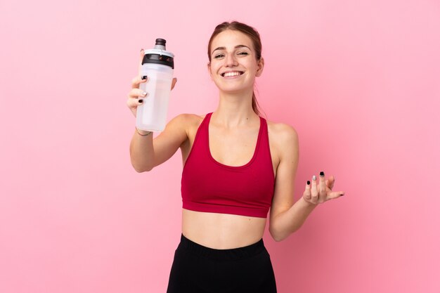 Young sport woman over isolated wall 