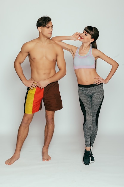 Young sporty couple in studio