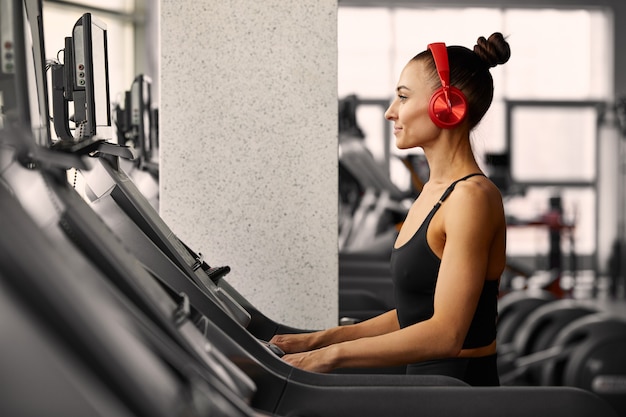 Young sporty woman doing workout in the gym