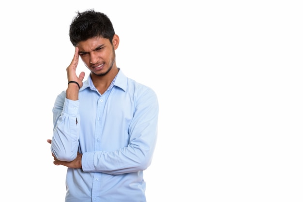 young stressed Indian man having headache