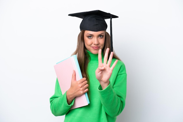 Young student caucasian woman isolated on white background happy and counting four with fingers