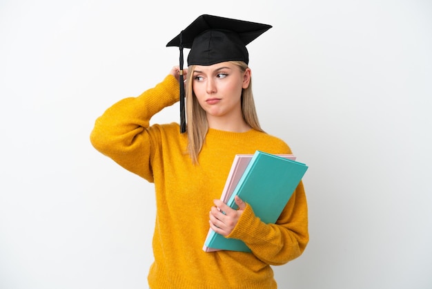 Young student caucasian woman isolated on white background having doubts