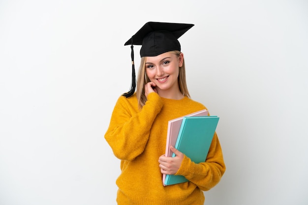 Young student caucasian woman isolated on white background laughing