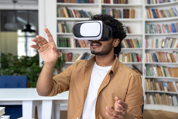 Young student closeup inside university academic library studying man uses vr virtual reality