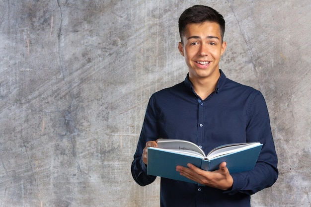 Young student man with a book